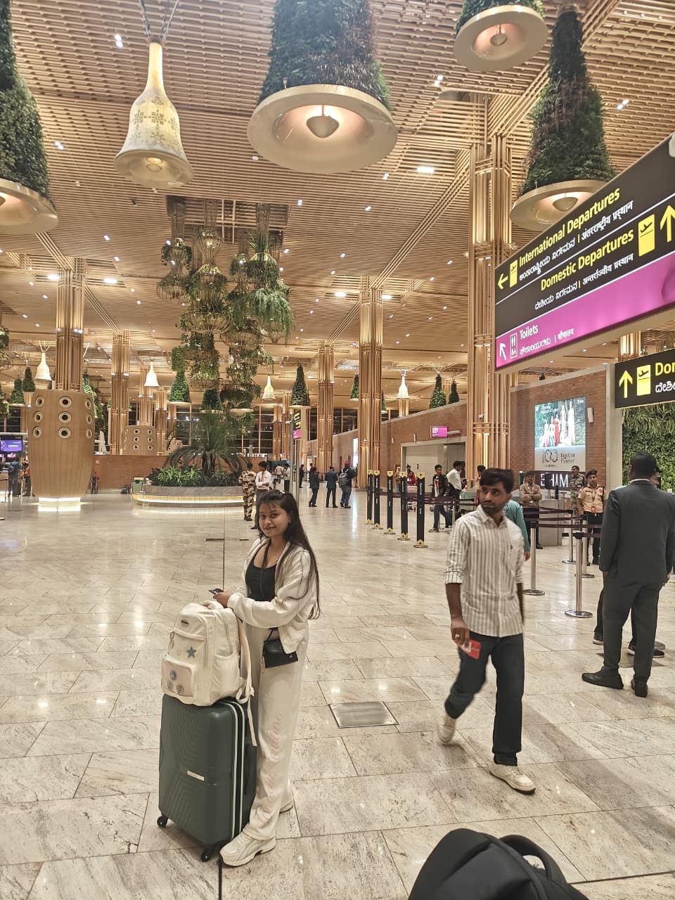 Sanskriti with her luggage at the airport