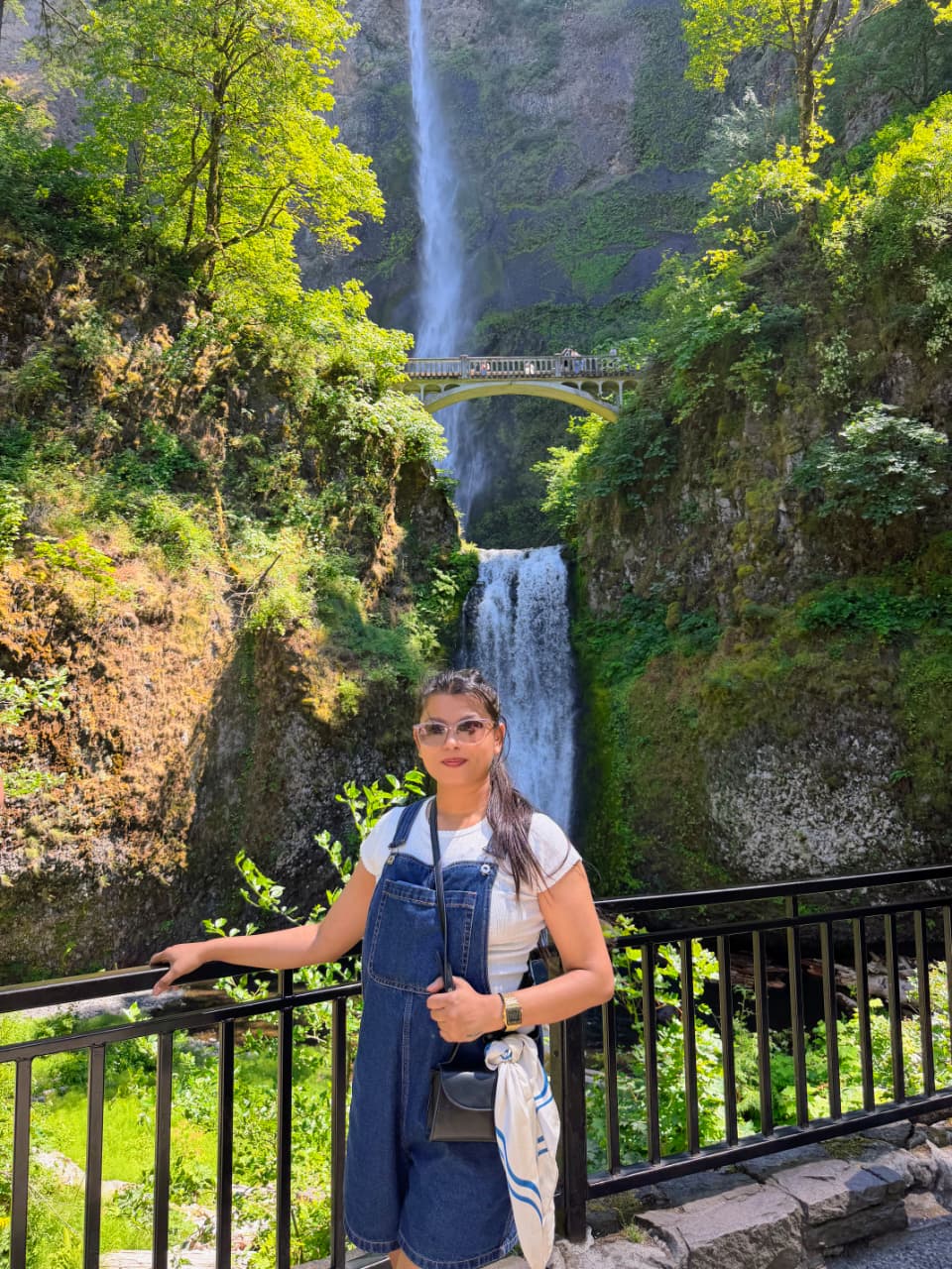 Sanskriti in front of Multnomah Falls and its stone bridge