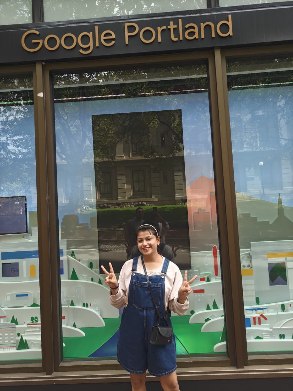 Sanskriti with double peace signs at Google Portland