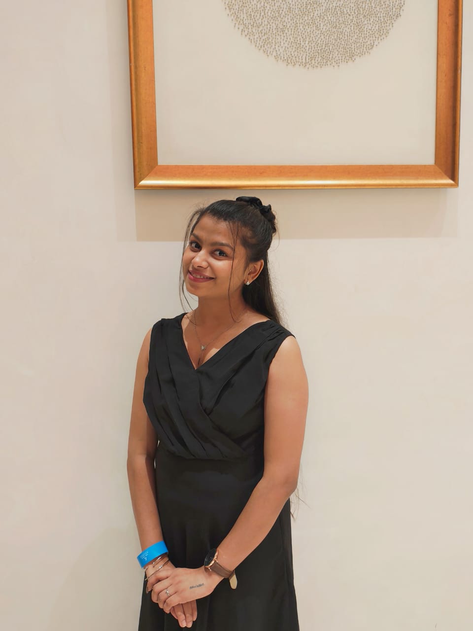 Sanskriti smiling under a golden frame